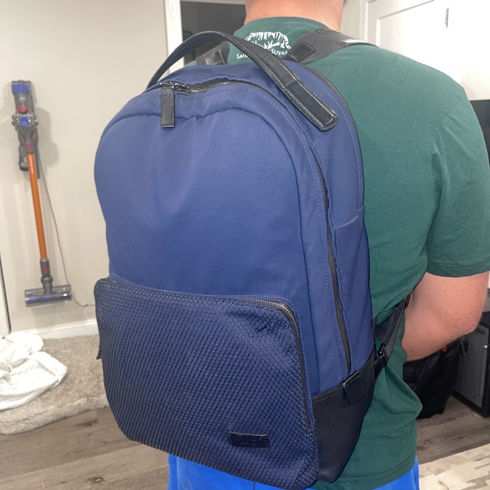 Tumi Leather and Nylon Navy backpack.